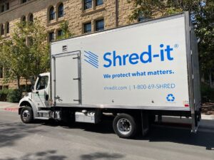 Shred-it truck parked at client office building. Shred-it is an information security solution[buzzword] provided by Stericycle Inc - San Jose, California, USA - 2022