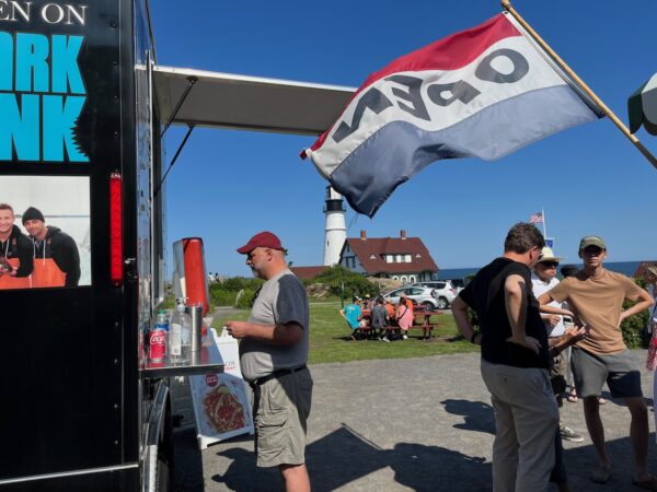 cousins lobster food truck with portland head light in back ground