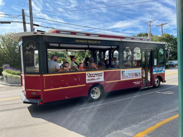 kid waving on ogunquit trolley on shore road