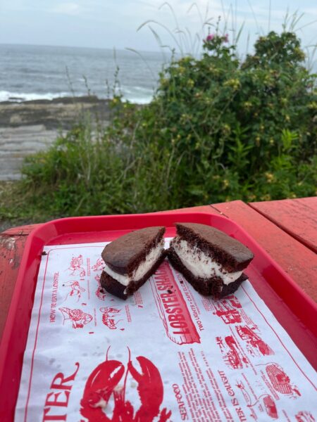 maine whoopie pie cut open at two lights with ocean in background