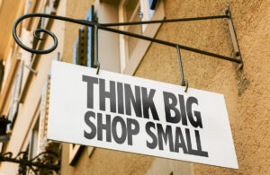 Think Big Shop Small sign in a conceptual image