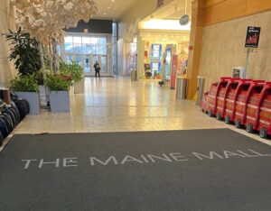 rug at the maine mall entrance
