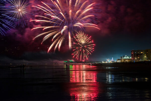 Fireworks explode over the beach at Old Orchard Beach, Maine.