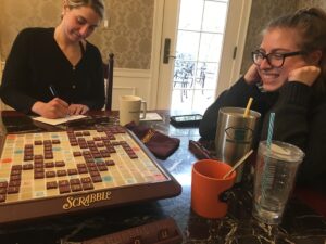 Two women playing Scrabble.